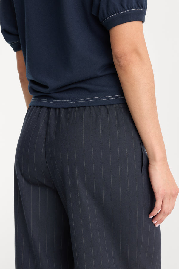 THE PINSTRIPE PULL ON TROUSER | NAVY PINSTRIPE-6 | GOOD AMERICAN | MODEL